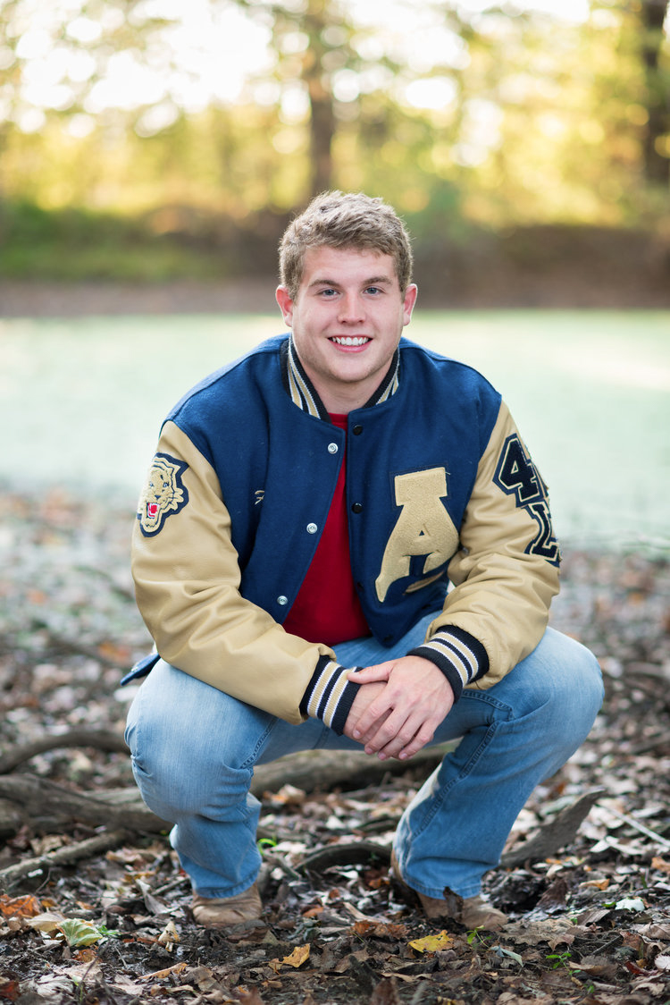 Oahu Senior Photographer | Male high school senior in letter jacket