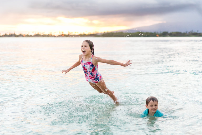 Best Family Photographer on Oahu Hawaii | Kids at beach in the ocean in Honolulu, Oahu, Hawaii at sunset
