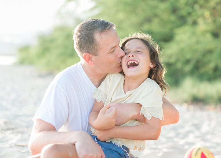 Oahu Fine Art Family Photography | Dad hugging daughter on Honolulu beach