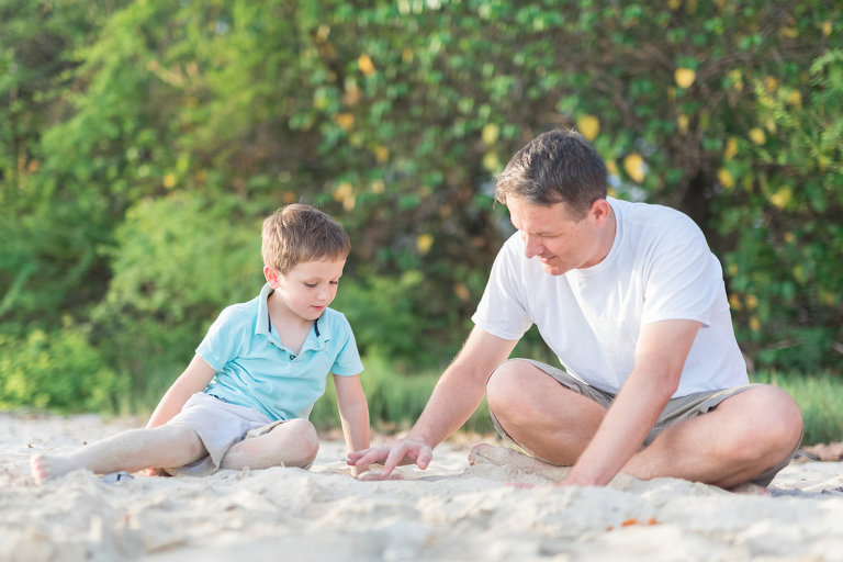 Oahu Family Photographers | Honolulu dad and found son playing on beach